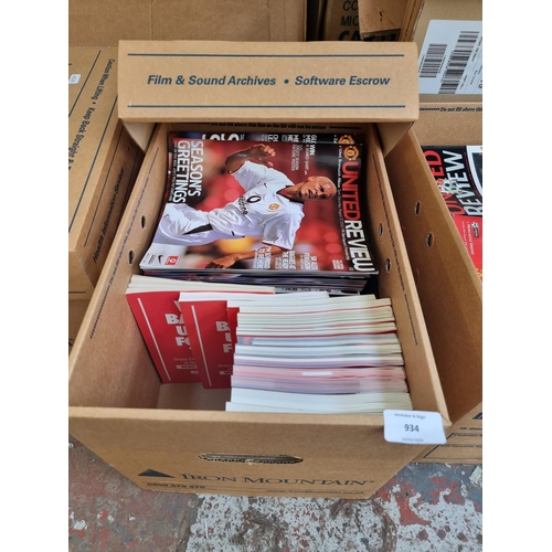 934 - A box containing a large quantity of United Review football programs