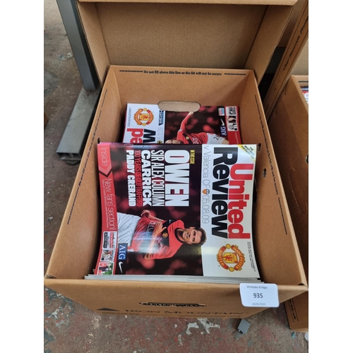 935 - A box containing a large quantity of United Review football programs