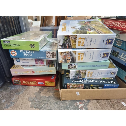 957 - A collection of boxed jigsaw puzzles