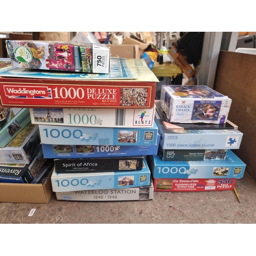 957 - A collection of boxed jigsaw puzzles