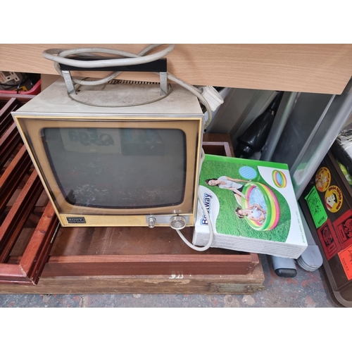 966 - A collection of house clearance items to include vintage Sony solid state transistor TV - model numb... 