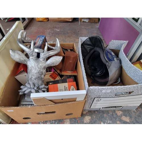 975 - Two boxes containing house clearance items to include contemporary stag candle holder, vintage pengu... 