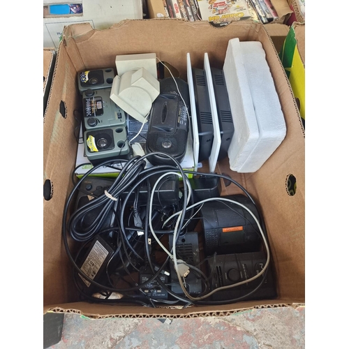 982 - Three boxes containing electrical items to include Philips eight inch photo frame, docking stations,... 