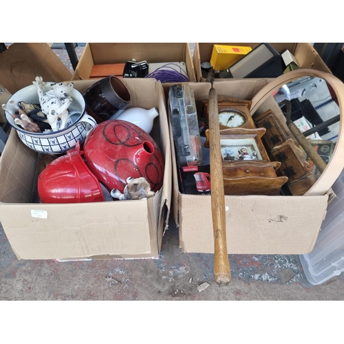 983 - Two boxes containing house clearance items to include mid 20th century circular wall mirror, modern ... 