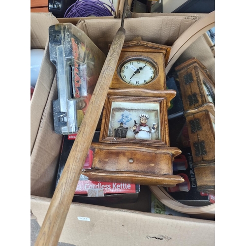 983 - Two boxes containing house clearance items to include mid 20th century circular wall mirror, modern ... 