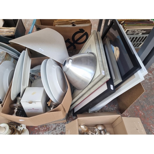 986 - Four boxes containing house clearance items to include table lamps, silver plated cutlery, ceramics,... 