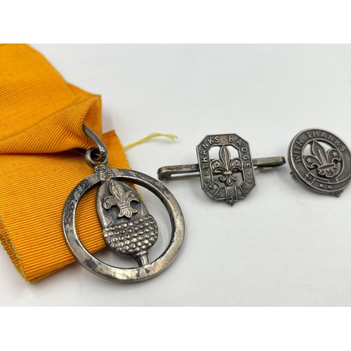 1337 - Three hallmarked sterling silver Boy Scouts badges and medals - approx. gross weight 25 grams