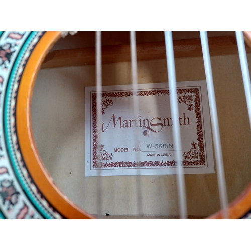 735 - Two musical instruments, one Martin Smith W-560/N ¾ size nylon strung classical guitar and one cased... 