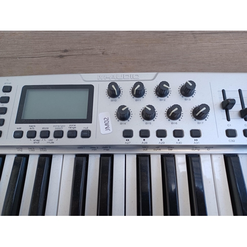 740 - An M-Audio Ozonic midi controller/FireWire audio interface