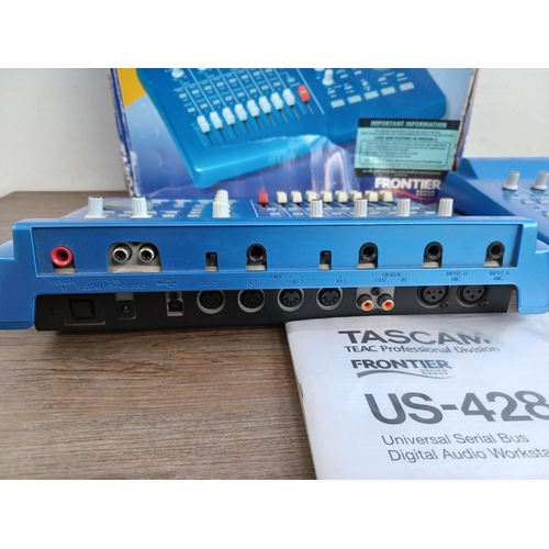 741 - Two Tascam US-428 universal serial bus digital audio workstation controllers, one boxed with instruc... 