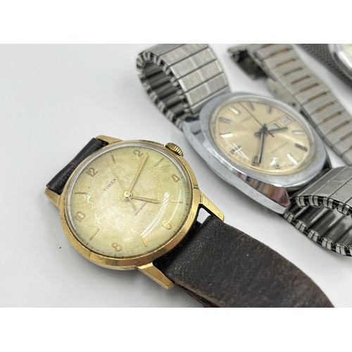 1266 - Four vintage Timex mechanical and quartz men's wristwatches