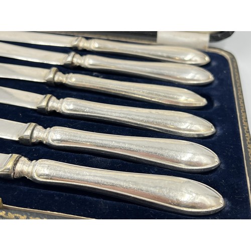 1335 - A cased set of six Harrison Fisher & Co hallmarked Sheffield silver handled knives, dated 1921