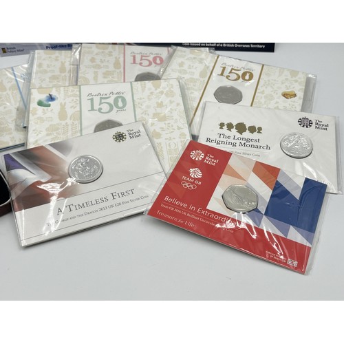 1346 - A collection of sealed Great British The Royal Mint and British Pobjoy Mint collectible coins to inc... 