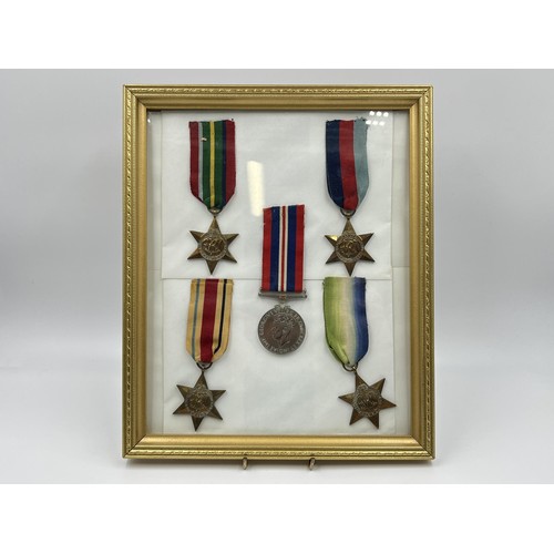 1347 - Five framed WWII British medals, one The Africa Star, one The Atlantic Star, one The Pacific Star, o... 