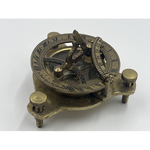 1350 - An F.L. West 31 Lock Spur FL. London brass sundial compass with unassociated wooden box