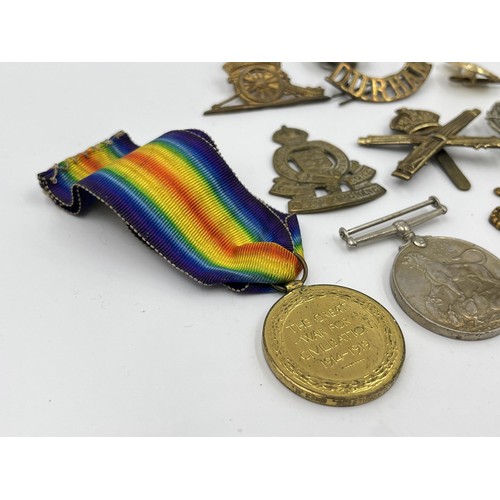 1356 - A collection of militaria and medals to include WWI 1914-1919 Victory medal presented to 200419 PTE.... 