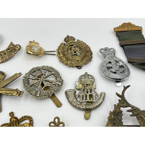 1356 - A collection of militaria and medals to include WWI 1914-1919 Victory medal presented to 200419 PTE.... 