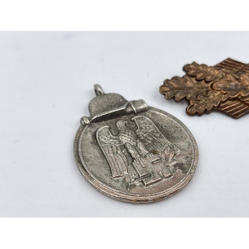 1358 - Two WWII German military items, one Close Combat clasp, stamped 'FEC. W.E. Peekhaus Berlin' and one ... 