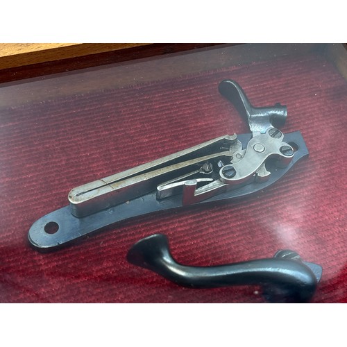 1365 - A 19th century percussion pistol lock in display case - approx. 15cm high x 20cm wide