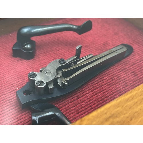 1365 - A 19th century percussion pistol lock in display case - approx. 15cm high x 20cm wide