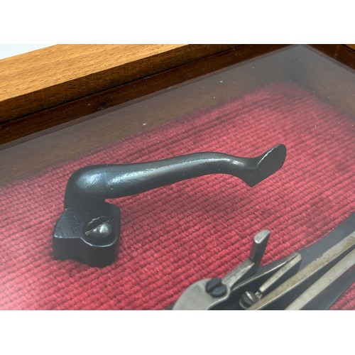 1365 - A 19th century percussion pistol lock in display case - approx. 15cm high x 20cm wide