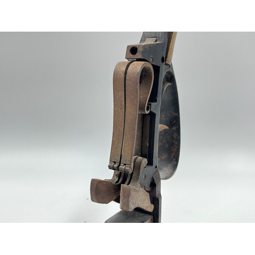 1366 - A 19th century flintlock pistol frame on wooden stand - approx. 21cm high