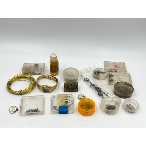 1253B - A large collection of watch parts and watchmakers accessories to include dials, movements, tools, Ro... 