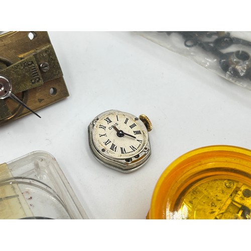 1253B - A large collection of watch parts and watchmakers accessories to include dials, movements, tools, Ro... 