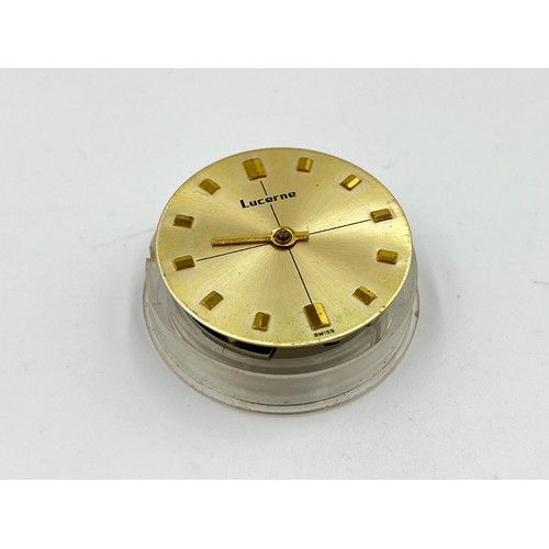 1253B - A large collection of watch parts and watchmakers accessories to include dials, movements, tools, Ro... 