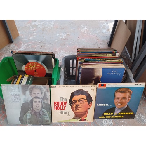 761 - Two boxes containing vinyl records and DVDs to include Buddy Holly, Simon and Garfunkel, Phil Collin... 