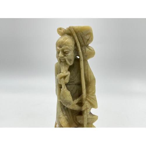 1340A - A Chinese carved soapstone fisherman figurine - approx. 15cm high