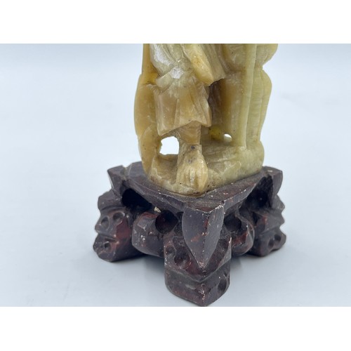 1340A - A Chinese carved soapstone fisherman figurine - approx. 15cm high