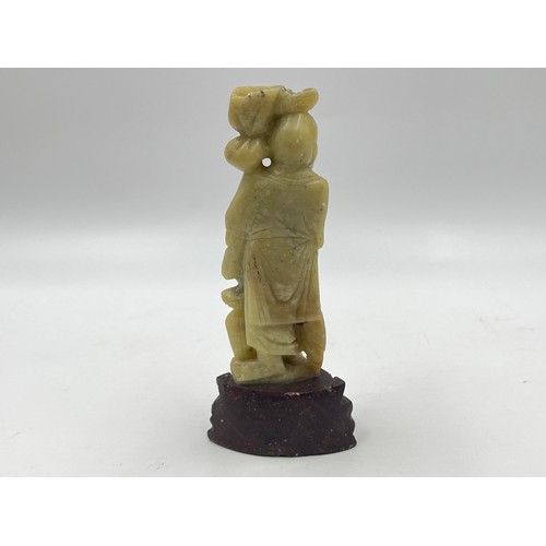 1340A - A Chinese carved soapstone fisherman figurine - approx. 15cm high