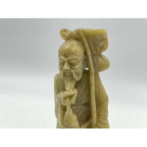 1340A - A Chinese carved soapstone fisherman figurine - approx. 15cm high