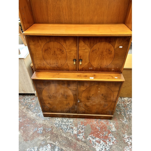 25 - A Georgian style yew wood bookcase