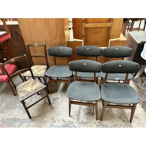 10 - Seven chairs, five mid 20th century beech and black fabric upholstered dining chairs and two Edwardi... 