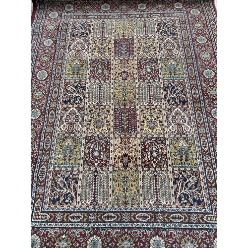 105 - A large Persian style red rug