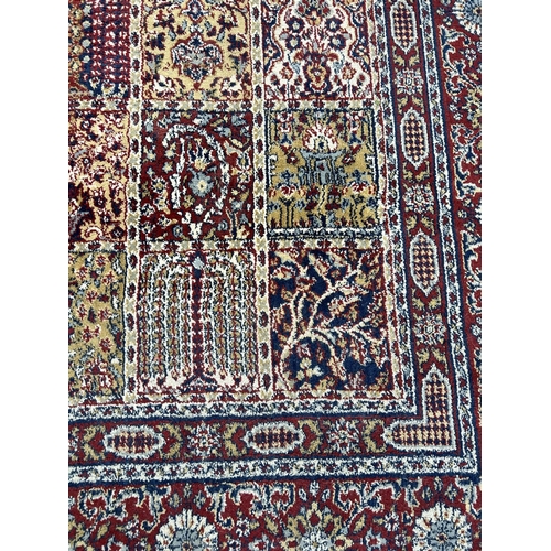 105 - A large Persian style red rug