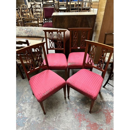 11 - A set of four mahogany and red fabric upholstered dining chairs