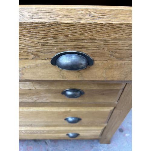 145 - A modern solid oak chest of two short over three long drawers