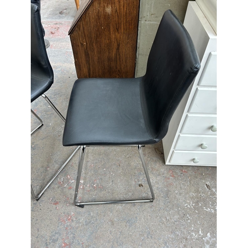 176 - A pair of modern black leatherette and tubular metal kitchen barstools