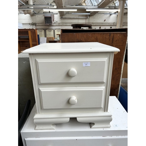 177 - A modern white painted pine bedside chest of two drawers