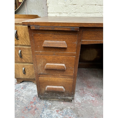 18 - A 1930s mahogany pedestal office desk with seven drawers - approx. 76cm high x 126cm wide x 76cm dee... 