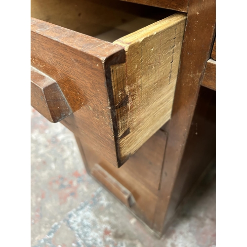 18 - A 1930s mahogany pedestal office desk with seven drawers - approx. 76cm high x 126cm wide x 76cm dee... 