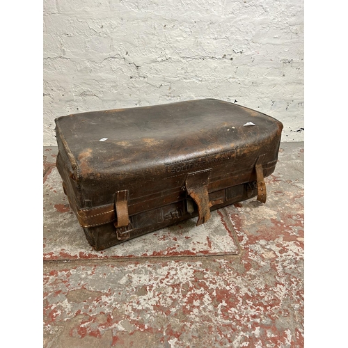 181 - An early 20th century brown leather suitcase monogrammed K. B.