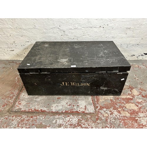 183 - An early 20th century black metal travel trunk