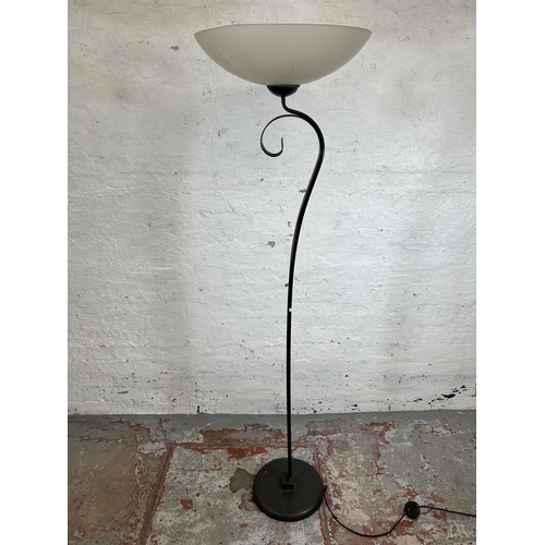 184 - A modern brown metal standard lamp with glass shade - approx. 179cm high