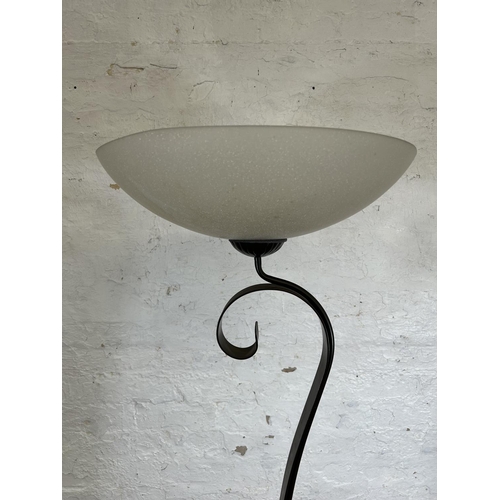 184 - A modern brown metal standard lamp with glass shade - approx. 179cm high