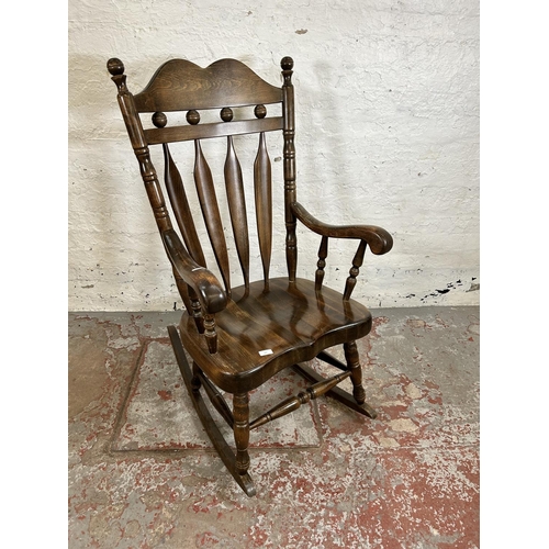 185 - A Victorian style beech farmhouse rocking chair
