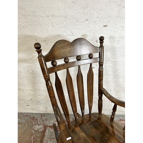 185 - A Victorian style beech farmhouse rocking chair